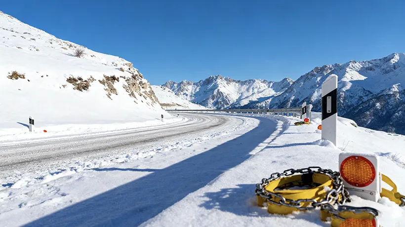 Winter Driving in Albania: Road Conditions, Safety Tips & Mountain Pass Guide (December-February) 1 - Car Rent in Albania Snow covered mountain pass road in Albania with winter driving conditions and safety equipment