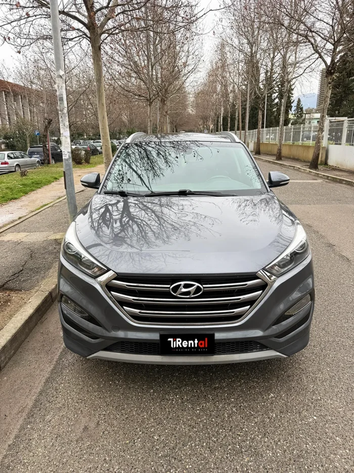 Front view of Hyundai Tucson 2017 dark grey SUV available for rental in Tirana, Albania