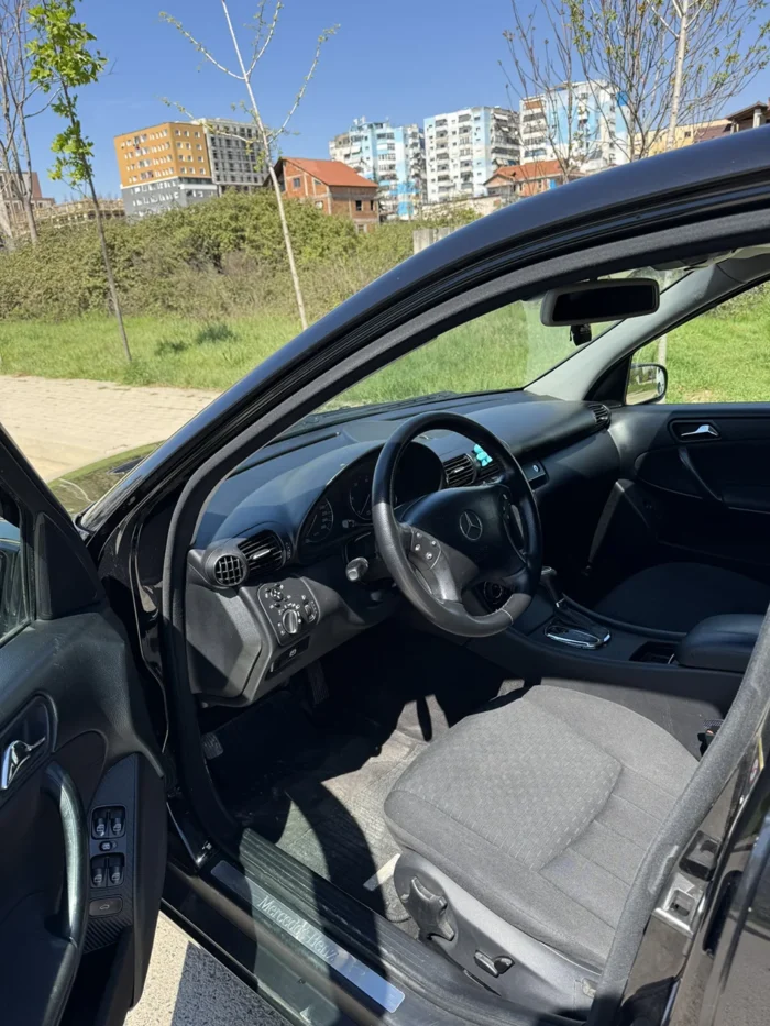 Driver’s seat and dashboard of Mercedes C-Class 2007 C220 diesel automatic with door open