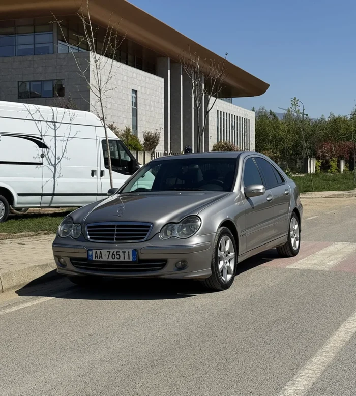 Grey Mercedes C-Class 2007 2.2 diesel automatic sedan front angle view parked on a sunny day in Tirana