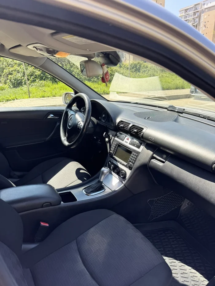 Front passenger seat and dashboard of grey Mercedes C-Class 2007 2.2 diesel automatic sedan