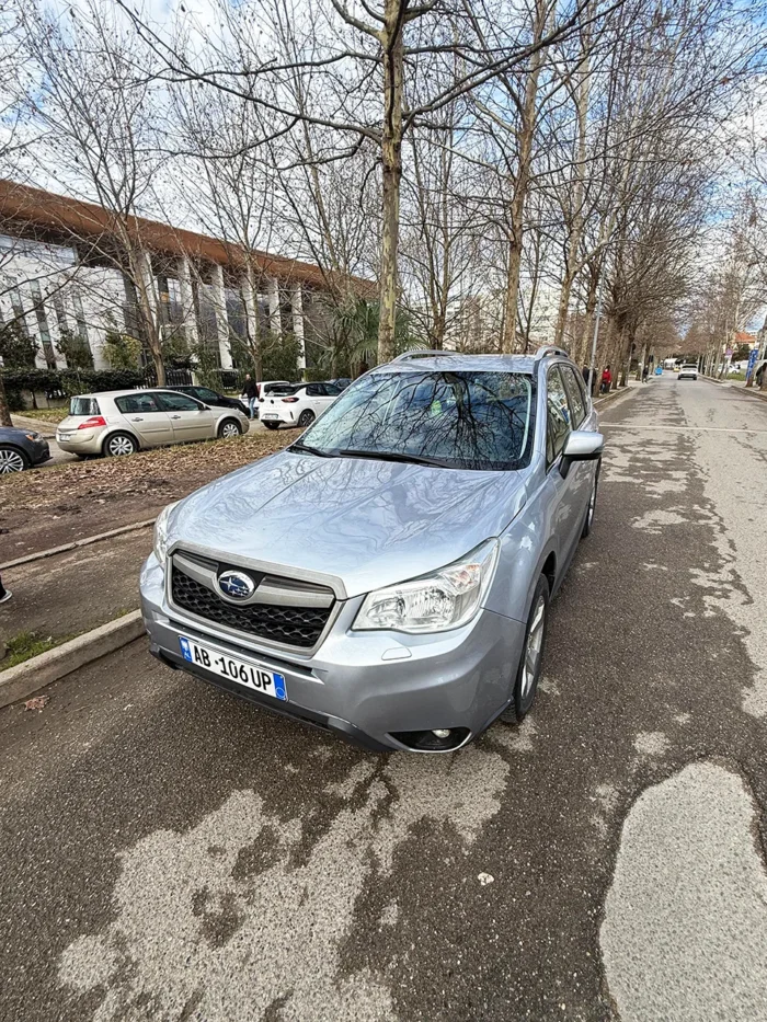 Subaru Forester 2015 silver 4x4 automatic SUV at front angle available for rental in Albania