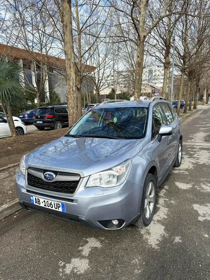 Subaru Forester 2015 silver 4x4 automatic SUV front three-quarter view parked on a street in Tirana, Albania