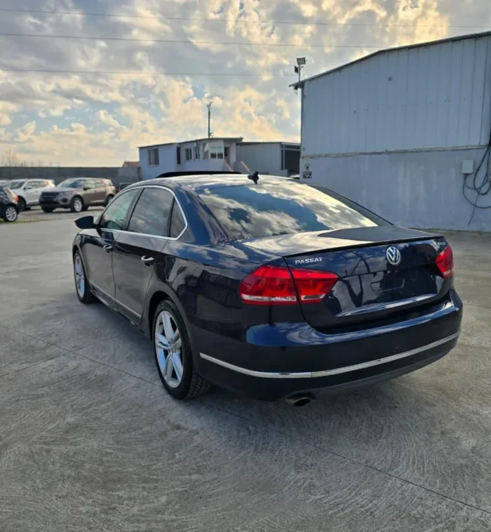 Side and rear view of VW Passat SEL 2013 diesel automatic rental car with visible sunroof in Albania