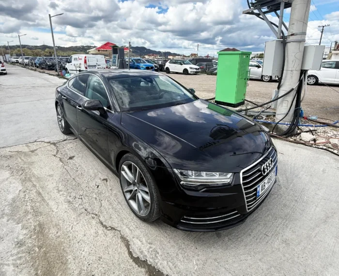 White Audi A7 2017 3.0 TDI diesel automatic luxury sedan with panoramic sunroof, parking sensors and reverse camera available for rent from TiRental in Albania
