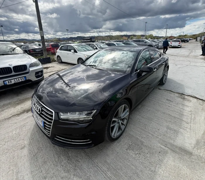 White Audi A7 2017 3.0 TDI diesel automatic luxury sedan with panoramic sunroof, parking sensors and reverse camera available for rent from TiRental in Albania