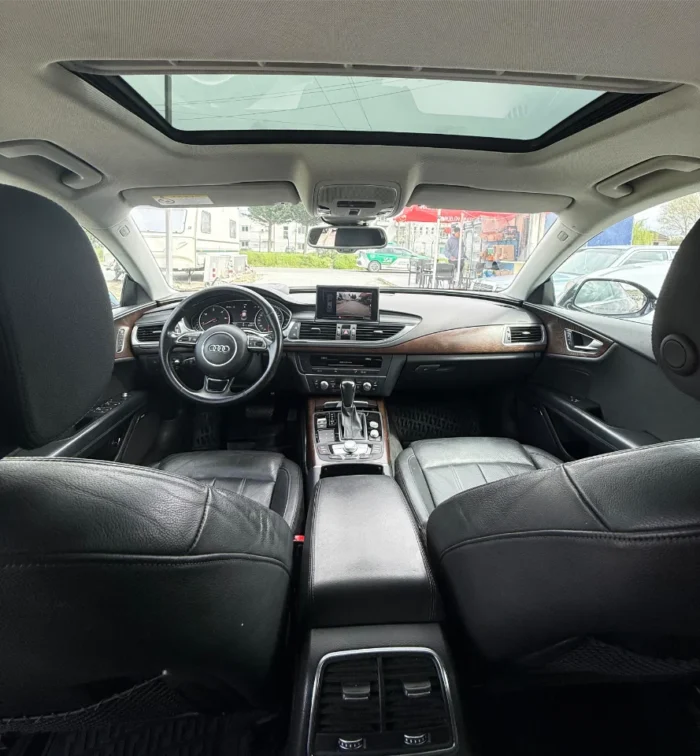 White Audi A7 2017 3.0 TDI diesel automatic luxury sedan with panoramic sunroof, parking sensors and reverse camera available for rent from TiRental in Albania