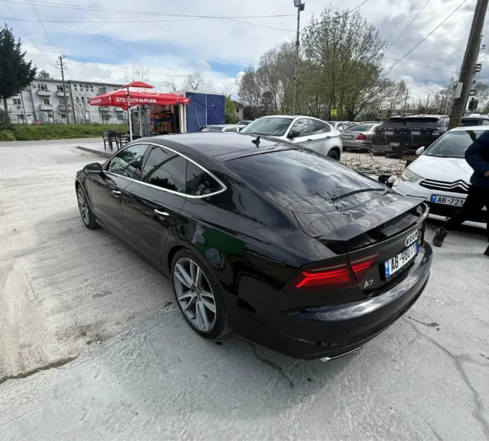 White Audi A7 2017 3.0 TDI diesel automatic luxury sedan with panoramic sunroof, parking sensors and reverse camera available for rent from TiRental in Albania