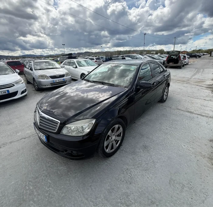 Black Mercedes-Benz C-Class 2010 C220 CDI 2.2 diesel automatic premium sedan available for business car rental at Tirana Airport Albania