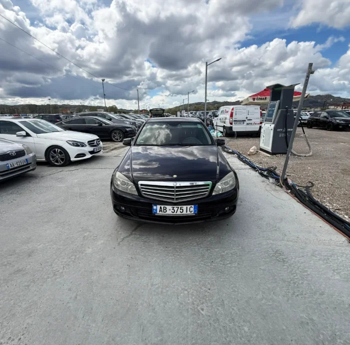 Black Mercedes-Benz C-Class 2010 C220 CDI 2.2 diesel automatic premium sedan available for business car rental at Tirana Airport Albania