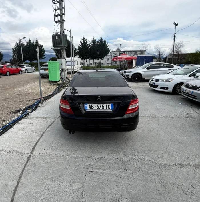 Black Mercedes-Benz C-Class 2010 C220 CDI 2.2 diesel automatic premium sedan available for business car rental at Tirana Airport Albania