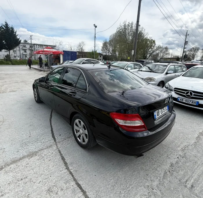 Black Mercedes-Benz C-Class 2010 C220 CDI 2.2 diesel automatic premium sedan available for business car rental at Tirana Airport Albania