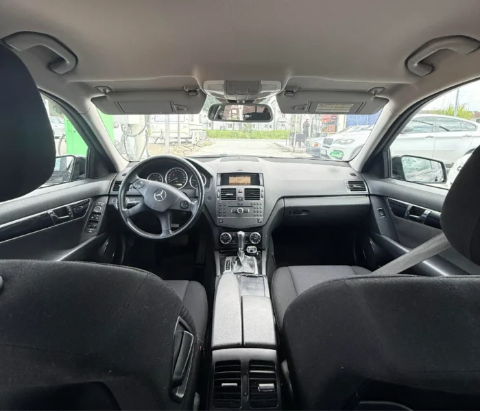 Black Mercedes-Benz C-Class 2010 C220 CDI 2.2 diesel automatic premium sedan available for business car rental at Tirana Airport Albania