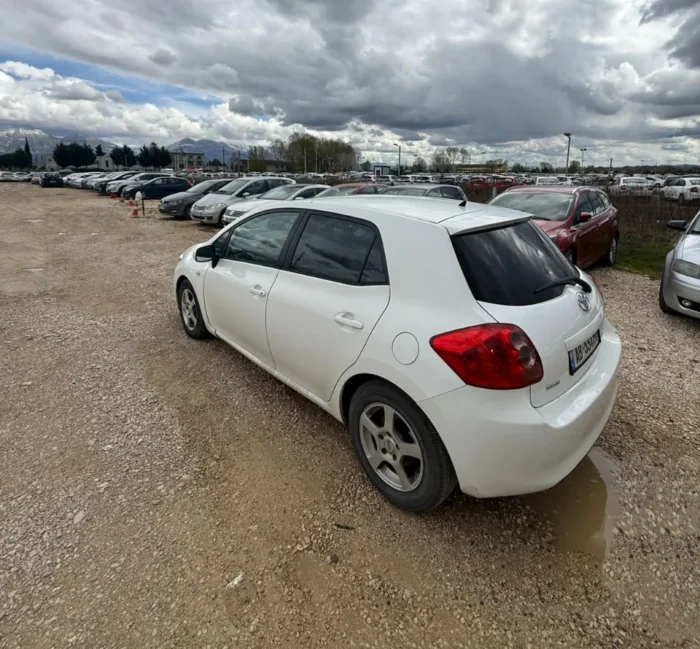 White Toyota Auris 2010 1.4 diesel manual hatchback rental car available from TiRental in Albania