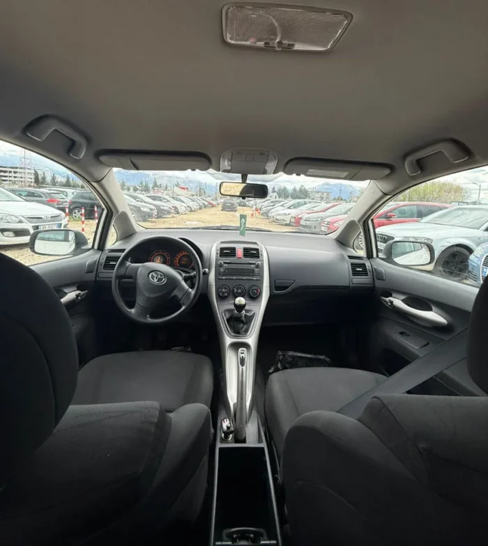 White Toyota Auris 2010 1.4 diesel manual hatchback rental car available from TiRental in Albania