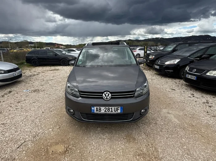 Front view of gray VW Touran 2013 7-seater 2.0 TDI diesel automatic rental MPV available at Tirana airport