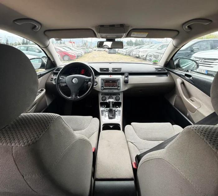 Black Volkswagen Passat 2010 2.0 TDI diesel automatic sedan rental car parked near Tirana International Airport Rinas with spacious, air‑conditioned interior