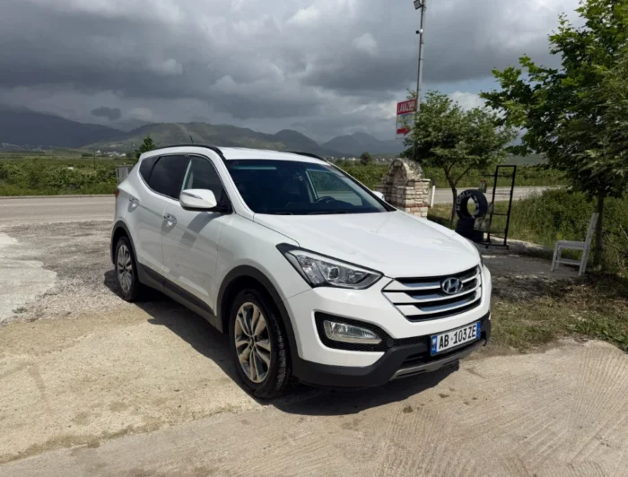 White Hyundai Santa Fe 2015 2.2 diesel automatic 7 seater SUV parked near Tirana, available for car rental in Albania with TiRental
