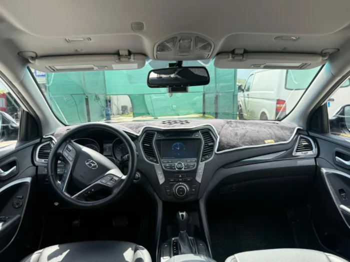 White Hyundai Santa Fe 2015 2.2 diesel automatic 7 seater SUV parked near Tirana, available for car rental in Albania with TiRental