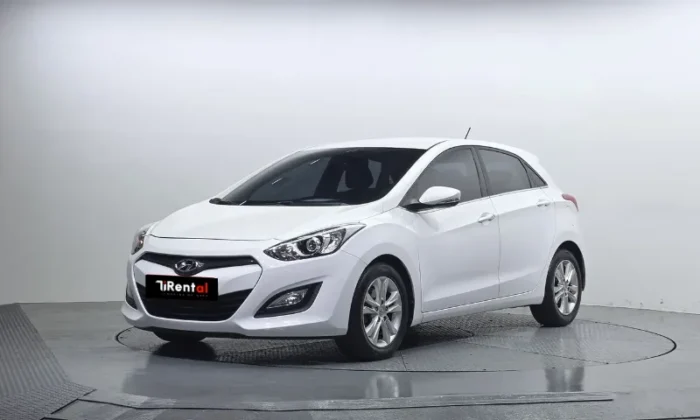 White Hyundai i30 2013 1.6 diesel automatic five‑door hatchback with alloy wheels, available for car rental in Tirana Albania from TiRental