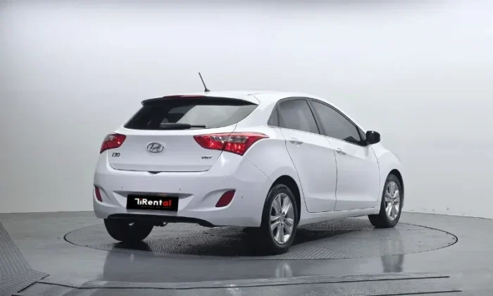 White Hyundai i30 2013 1.6 diesel automatic five‑door hatchback with alloy wheels, available for car rental in Tirana Albania from TiRental