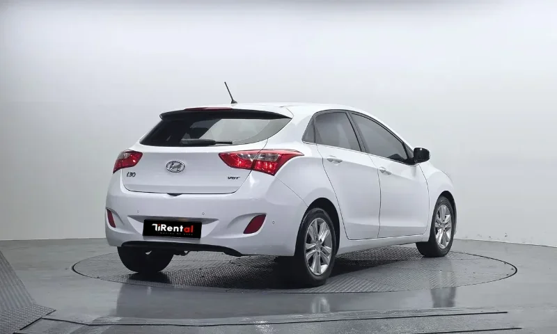 Hyundai i30 2013 – 1.6 Diesel Automatic Hatchback Rental in Tirana Albania 49 - Car Rent in Albania White Hyundai i30 2013 1.6 diesel automatic five‑door hatchback with alloy wheels, available for car rental in Tirana Albania from TiRental