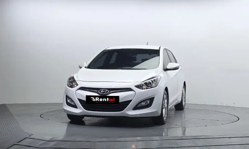 Hyundai i30 2013 – 1.6 Diesel Automatic Hatchback Rental in Tirana Albania 48 - Car Rent in Albania White Hyundai i30 2013 1.6 diesel automatic five‑door hatchback with alloy wheels, available for car rental in Tirana Albania from TiRental
