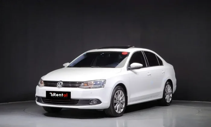 White Volkswagen Jetta 2014 2.0 TDI diesel automatic sedan with sunroof and TiRental branding, available for car rental in Tirana Albania