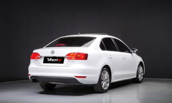 White Volkswagen Jetta 2014 2.0 TDI diesel automatic sedan with sunroof and TiRental branding, available for car rental in Tirana Albania