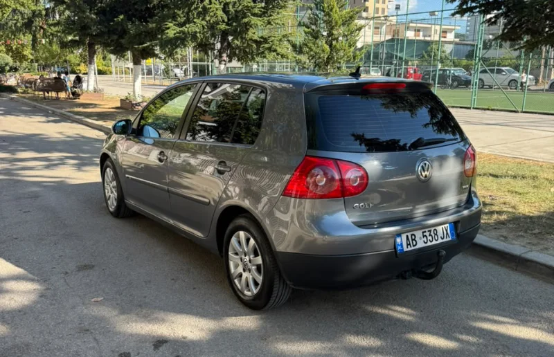 Volkswagen Golf V 2007 1.9 TDI Automatic Diesel – Compact Hatchback Rental in Albania 34 - Car Rent in Albania Grey Volkswagen Golf V 2007 1.9 TDI automatic diesel five‑door hatchback parked in Tirana, available for car rental in Albania with TiRental