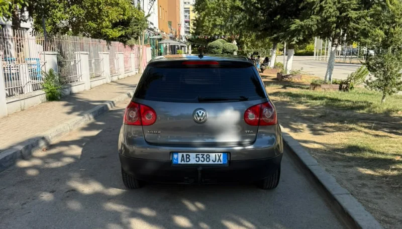 Volkswagen Golf V 2007 1.9 TDI Automatic Diesel – Compact Hatchback Rental in Albania 36 - Car Rent in Albania Grey Volkswagen Golf V 2007 1.9 TDI automatic diesel five‑door hatchback parked in Tirana, available for car rental in Albania with TiRental