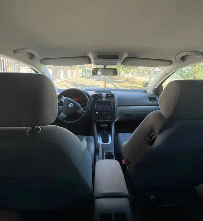 Grey Volkswagen Golf V 2007 1.9 TDI automatic diesel five‑door hatchback parked in Tirana, available for car rental in Albania with TiRental