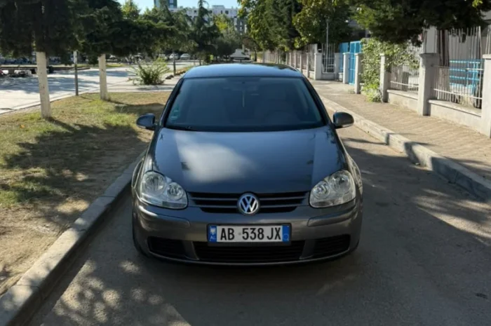 Grey Volkswagen Golf V 2007 1.9 TDI automatic diesel five‑door hatchback parked in Tirana, available for car rental in Albania with TiRental