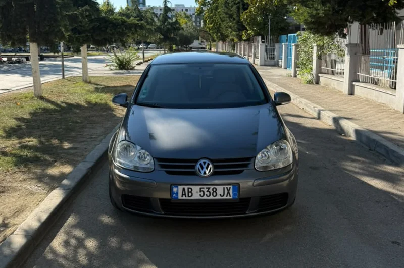 Volkswagen Golf V 2007 1.9 TDI Automatic Diesel – Compact Hatchback Rental in Albania 35 - Car Rent in Albania Grey Volkswagen Golf V 2007 1.9 TDI automatic diesel five‑door hatchback parked in Tirana, available for car rental in Albania with TiRental