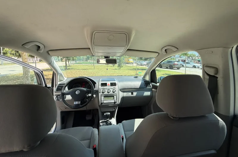 Volkswagen Touran 2.0 TDI Automatic 2008 - 7 Seater Family Van Rental in Albania 47 - Car Rent in Albania Silver Volkswagen Touran 2.0 TDI automatic 2008 seven‑seater MPV parked in Tirana, available for family van rental in Albania with TiRental