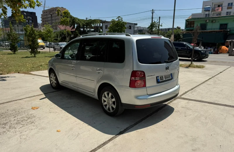 Volkswagen Touran 2.0 TDI Automatic 2008 - 7 Seater Family Van Rental in Albania 44 - Car Rent in Albania Silver Volkswagen Touran 2.0 TDI automatic 2008 seven‑seater MPV parked in Tirana, available for family van rental in Albania with TiRental