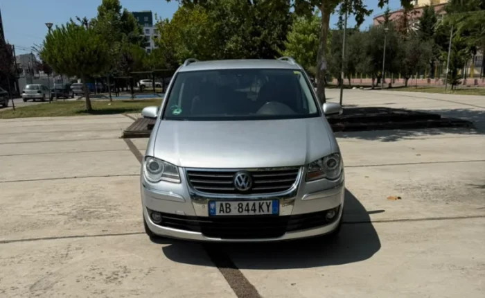 Silver Volkswagen Touran 2.0 TDI automatic 2008 seven‑seater MPV parked in Tirana, available for family van rental in Albania with TiRental