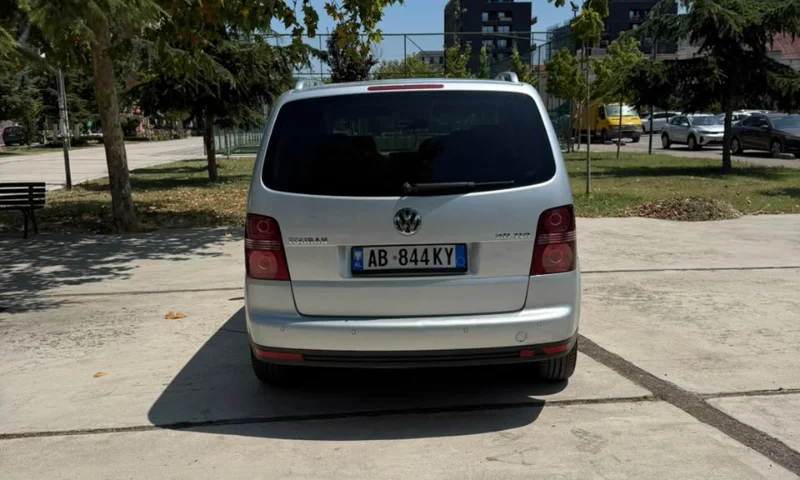 Volkswagen Touran 2.0 TDI Automatic 2008 - 7 Seater Family Van Rental in Albania 46 - Car Rent in Albania Silver Volkswagen Touran 2.0 TDI automatic 2008 seven‑seater MPV parked in Tirana, available for family van rental in Albania with TiRental