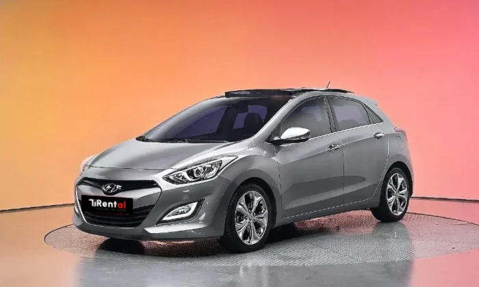 Grey Hyundai i30 2013 1.6 CRDi diesel automatic five‑door hatchback parked in Tirana, offered as a business project rental car in Albania by TiRental