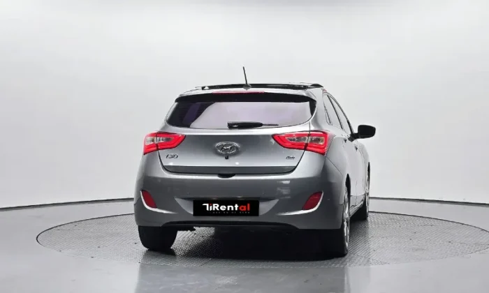 Grey Hyundai i30 2013 1.6 CRDi diesel automatic five‑door hatchback parked in Tirana, offered as a business project rental car in Albania by TiRental