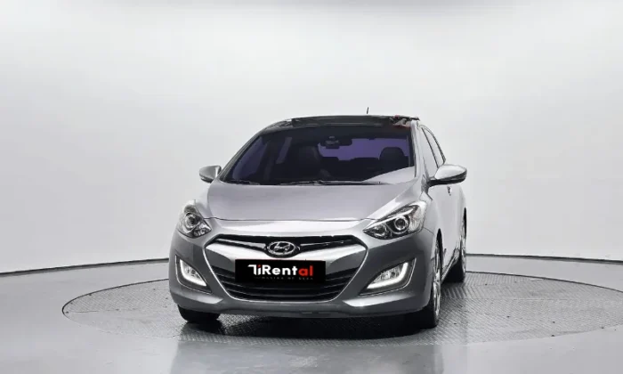 Grey Hyundai i30 2013 1.6 CRDi diesel automatic five‑door hatchback parked in Tirana, offered as a business project rental car in Albania by TiRental