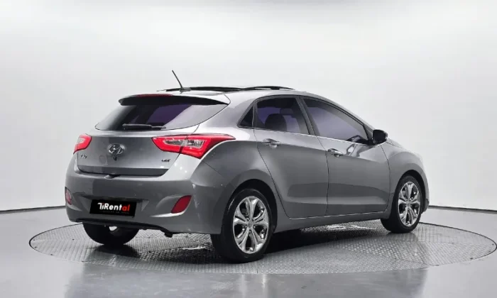 Grey Hyundai i30 2013 1.6 CRDi diesel automatic five‑door hatchback parked in Tirana, offered as a business project rental car in Albania by TiRental