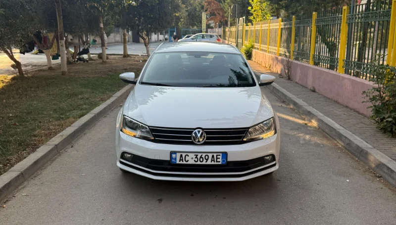 Volkswagen Jetta 2015 2.0 TDI Automatic - Comfortable Diesel Sedan Rental in Albania 44 - Car Rent in Albania White Volkswagen Jetta 2015 2.0 TDI automatic diesel sedan parked in Tirana, available for car rental in Albania with TiRental