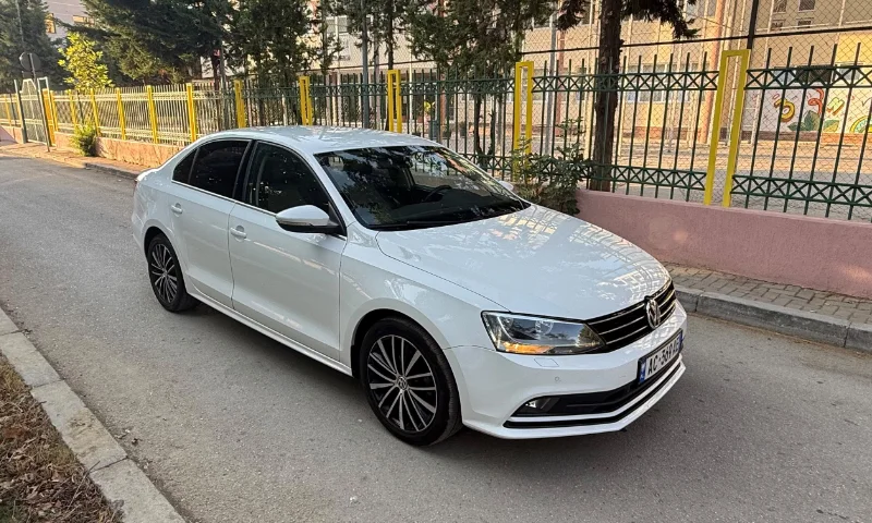 Volkswagen Jetta 2015 2.0 TDI Automatic - Comfortable Diesel Sedan Rental in Albania 43 - Car Rent in Albania White Volkswagen Jetta 2015 2.0 TDI automatic diesel sedan parked in Tirana, available for car rental in Albania with TiRental