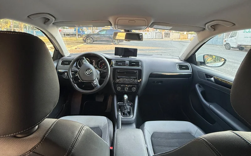 Volkswagen Jetta 2015 2.0 TDI Automatic - Comfortable Diesel Sedan Rental in Albania 47 - Car Rent in Albania White Volkswagen Jetta 2015 2.0 TDI automatic diesel sedan parked in Tirana, available for car rental in Albania with TiRental