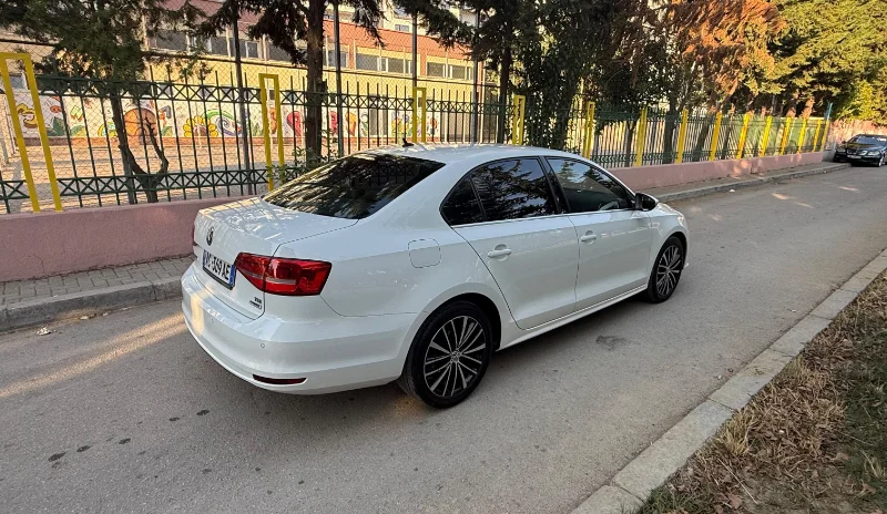 Volkswagen Jetta 2015 2.0 TDI Automatic - Comfortable Diesel Sedan Rental in Albania 45 - Car Rent in Albania White Volkswagen Jetta 2015 2.0 TDI automatic diesel sedan parked in Tirana, available for car rental in Albania with TiRental